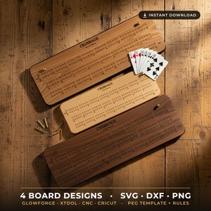 May include: Three rectangular wooden cribbage boards with drilled peg holes and the text "CRIBBAGE" printed on each. The boards vary in wood tone from light to dark. A hand of playing cards and several metal pegs are placed on the boards.