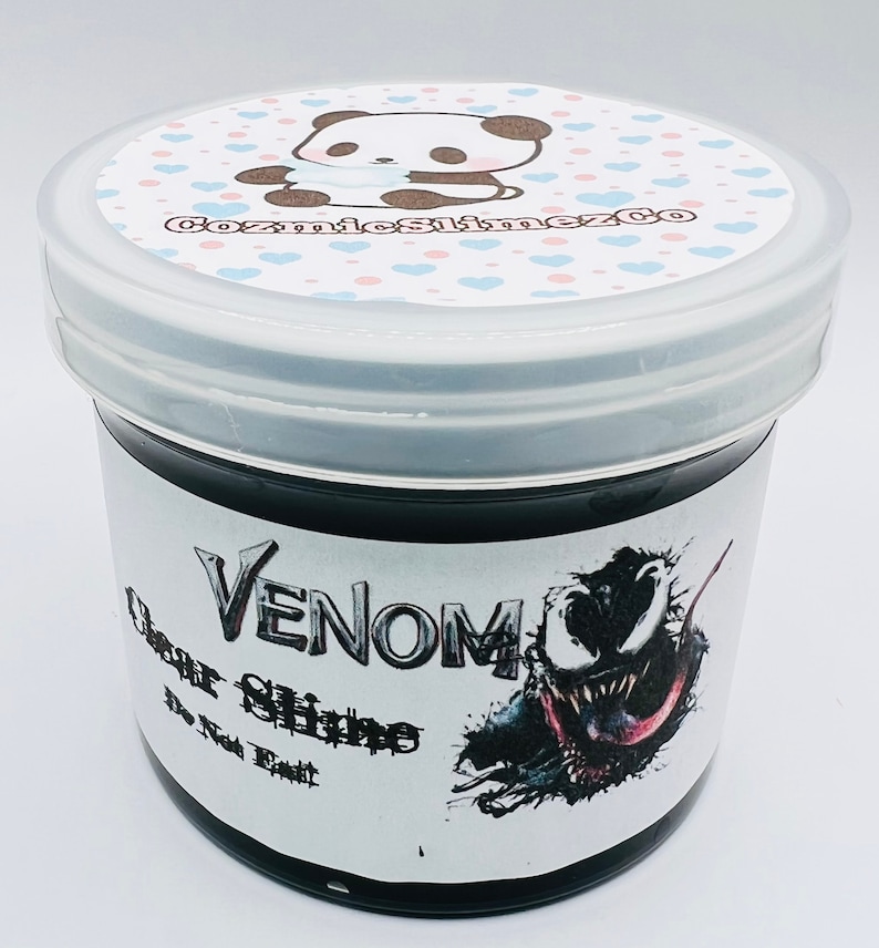 May include: A black slime jar with a white label that says "Venom Clear Slime The Toxic Treat". The label also features a cartoon image of Venom, a Marvel Comics character.