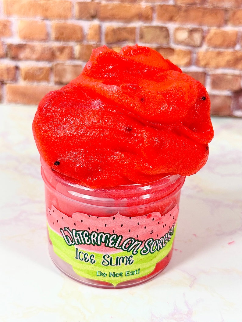 May include: A red watermelon sorbet icee slime in a clear jar with a green and white label that says "Watermelon Sorbet Icee Slime Do Not Eat!"