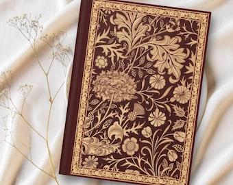 May include: A burgundy hardback journal with a gold floral design on the cover. The cover features a repeating pattern of leaves, flowers, and stems. The text "DARLINGS OF ART DESIGNS" is printed in gold at the bottom of the cover.
