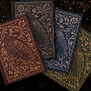 May include: Four hardcover journals featuring a raven perched on a branch surrounded by intricate gold-toned floral filigree and acorn motifs. The covers are colored in deep shades of burgundy, black, navy blue, and forest green with gold detailing.