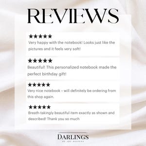 May include: A graphic display titled REVIEWS featuring four five-star ratings and customer testimonials about a notebook. The text includes comments on the soft texture and appearance of the item. At the bottom, the text reads DARLINGS OF ART DESIGNS.