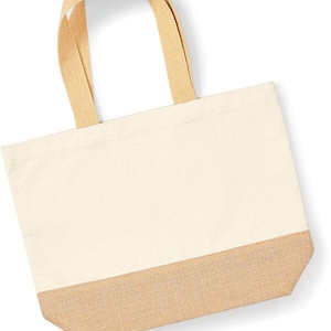 May include: A natural canvas tote bag with a jute bottom. The bag has two long, natural canvas straps.
