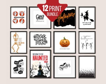 May include: A collection of 12 framed Halloween-themed prints. The prints feature various spooky designs, including ghosts, pumpkins, skeletons, and bats, with text like "Ghost", "Trick or Treat", and "Spooky".