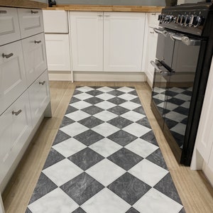 large kitchen with checkerboard pattern runner galley rug