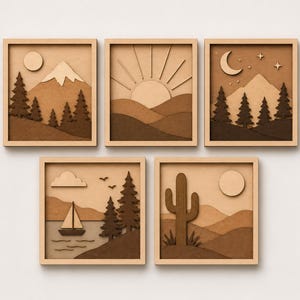 May include: Five framed wooden wall art pieces. Each depicts a different landscape: mountains, a sunrise, a moonlit mountain, a sailboat on a lake, and a desert scene with a cactus. The art is in shades of brown and beige.