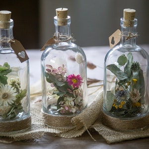 Candlestick with dried flowers and candle, glass bottle, decoration boho country house, dried flowers in glass