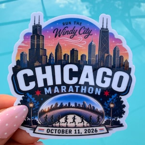 May include: A sticker featuring the Chicago Marathon. The design includes a skyline, the text "Run the Windy City," and the date "October 11, 2026." The sticker has a blue and white border and a colorful sunset background.