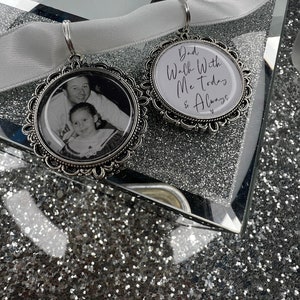 May include: Two silver charm pendants with a white satin ribbon. One pendant features a photo of a father and daughter, and the other pendant has the text "Dad Walk With Me Today & Always".