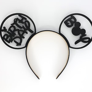 May include: Black Mickey Mouse ears headband with "Birthday" written on one ear and "Boo" with a Mickey Mouse silhouette on the other ear.