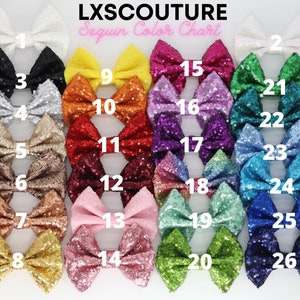 May include: A sequin color chart with 26 different colors of sequins arranged in bows. The colors are numbered 1 through 26.