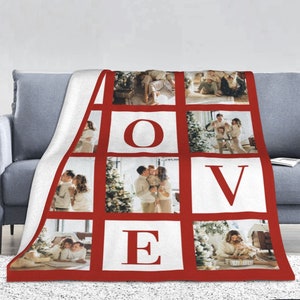 May include: A white fleece blanket with a red border and a collage of family photos. The photos are arranged in a grid pattern with the word "LOVE" spelled out in red letters.