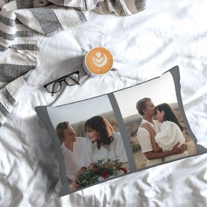 May include: A grey pillow with two photographs of a couple. The photograph on the left shows the couple standing in a field, while the photograph on the right shows the couple embracing.