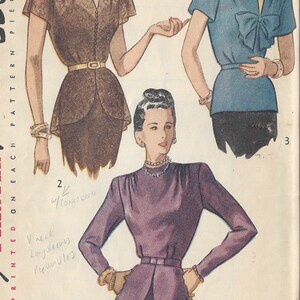 May include: A vintage sewing pattern from 1947 for three different blouses. The pattern is for a brown blouse with a V-neck and short sleeves, a blue blouse with a bow and short sleeves, and a purple blouse with long sleeves and a peplum.