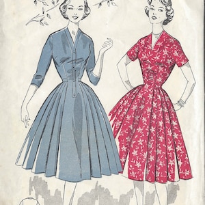 May include: Vintage sewing pattern for a dress, featuring two models wearing different versions of the dress. The pattern number is 9035 and the bust size is 36. The text "Early 1950s (152 1/6) Blackmore" is written on the top of the pattern.