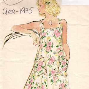 May include: Vintage sewing pattern for a floral print dress with a ruffled hem. The pattern is for size 14, bust 92cm. The pattern is from 1975 and is labeled "Very Easy Vogue Patterns".