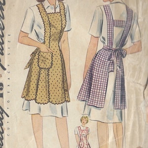 May include: Vintage sewing pattern for a women's apron. The pattern shows three different styles of aprons, one with a gingham print, one with a polka dot print, and one with a floral print. The pattern is labeled "1868" and "Medium".