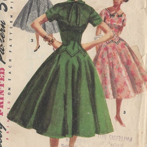 May include: Vintage sewing pattern for a green dress with a bow at the neck. The pattern is from 1955 and is size 11, bust 29 inches. The pattern is printed on each pattern piece.