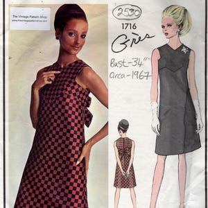 May include: A Vogue Paris Original sewing pattern envelope for a sleeveless shift dress with a checkered pattern and a back bow. The cover features the text VOGUE PARIS ORIGINAL, 2530, 1716, Grès, Bust-34, and Circa-1967, with illustrations of the dress.