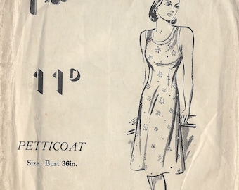 May include: A vintage sewing pattern for a petticoat. The pattern is for size 36 inches bust and requires 2 yards of 36 inch fabric. The pattern is illustrated with a line drawing of a woman wearing the petticoat.
