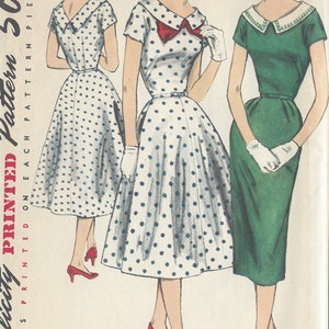 May include: A vintage sewing pattern from Simplicity for a 1950s dress. The pattern is for size 16, bust 34. The pattern includes three different styles of dresses: a polka dot dress with a large collar, a green dress with a white collar, and a green dress with a white collar.