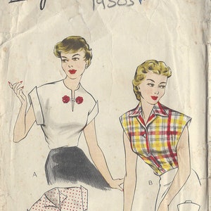 May include: Vintage sewing pattern for a blouse with three different styles. The pattern is for size 34 and is from the 1950s. The pattern is called "Economy Design" and the number is R548.