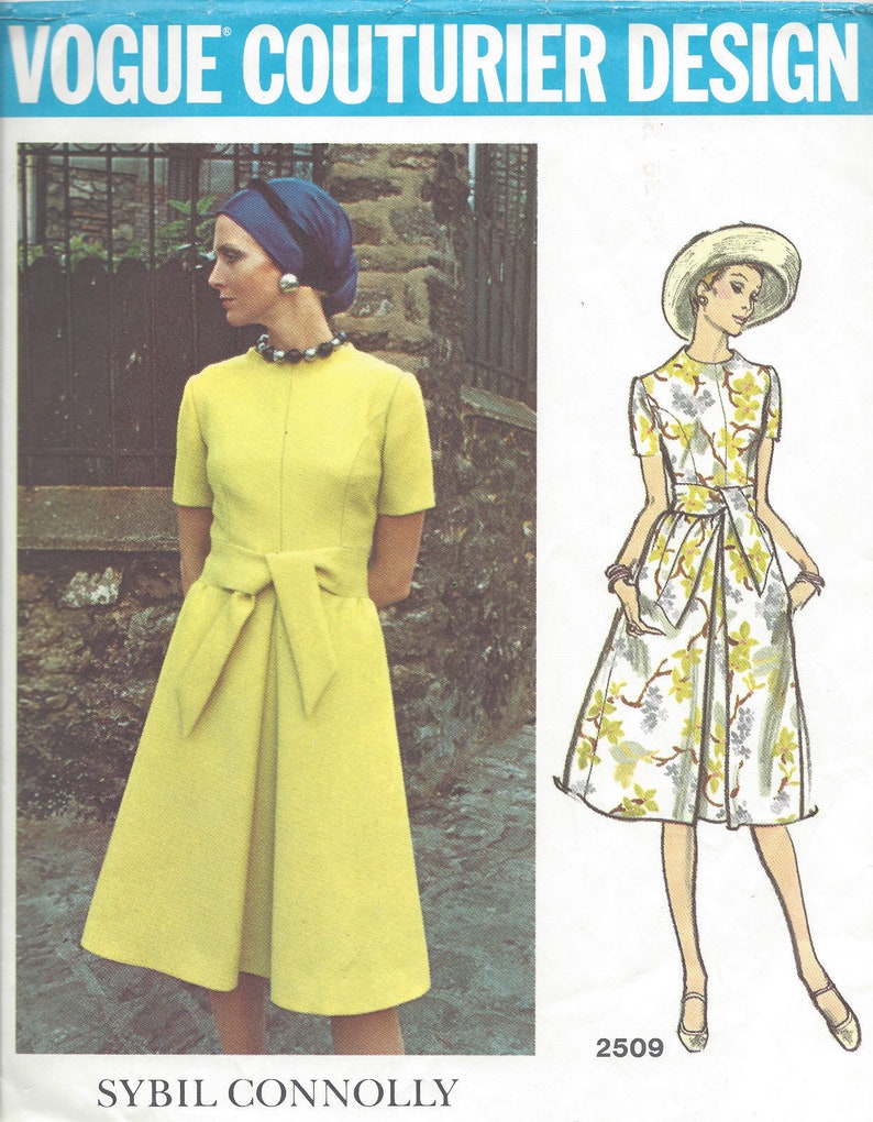 May include: A vintage Vogue Couturier Design sewing pattern for a dress. The pattern is for a yellow dress with a bow at the waist and a floral print dress. The pattern number is 2509 and the designer is Sybil Connolly.