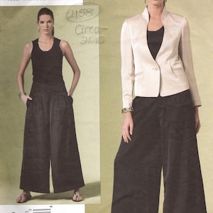 May include: Vogue pattern featuring Issey Miyake designs. The pattern includes a jacket and wide-leg trousers. The jacket is a light colour with a single button closure. The trousers are dark and wide-legged. The pattern is from circa 2010.