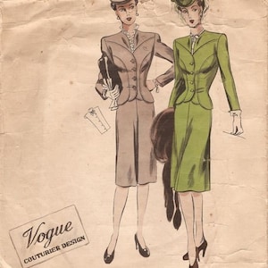 May include: Vintage Vogue Couturier Design pattern for a two-piece suit. The pattern shows two women wearing the suit in gray and green. The pattern number is 308.