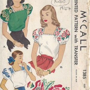 May include: Vintage McCall's sewing pattern for a blouse with embroidery design for the yoke and sleeves. The pattern is for size 14 and is printed on yellowed paper with the text "McCall's 1385 Printed Pattern with Transfer, Yellow or Blue, 45c".
