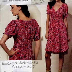 May include: A vintage Rebecca Taylor sewing pattern. The pattern shows a floral print dress with short sleeves and a V-neck. Bust measurements are 80 to 91 cm. Circa 2010. Pattern number V1152.