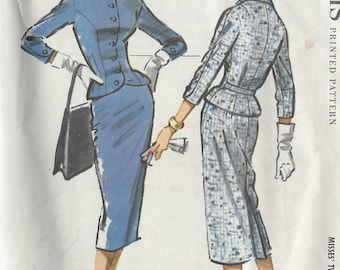 May include: Vintage sewing pattern for a two-piece suit. The pattern is printed on white paper with a blue and white checkered design. The pattern is for a misses' size 65c. The pattern is from 1957 and is printed by McCall's.