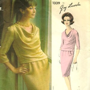 May include: Vogue Paris Original pattern 1339 by Guy Laroche for a dress with a cowl neck. The model on the left is wearing a gold dress and the model on the right is wearing a pink dress.