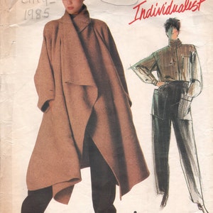 May include: Vintage Vogue sewing pattern for a long brown coat and pants by Issey Miyake. The pattern number is 1476 and the Vogue pattern number is 2162. The pattern is from 1985.