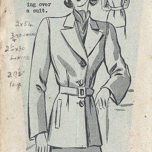 May include: A vintage sewing pattern for a long coat with large armholes. The pattern is for size 34 bust and 38 hips. The pattern number is 155453. The text on the pattern reads "Knuckle Length Coat with large armholes for wearing over a suit."