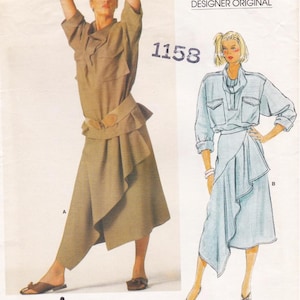 May include: Vogue Patterns Designer Original sewing pattern featuring two Issey Miyake designs. The pattern includes a top with a skirt and a wrap skirt with a collared shirt. The pattern number is 1158 and 1384.