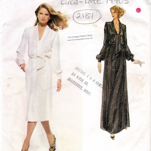May include: Vintage Vogue Paris Original sewing pattern from the late 1970s, featuring a white dress with a tie belt and a black polka dot dress with a bow. The pattern number is 2181 and the designer is Pierre Balmain.