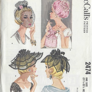 May include: Vintage sewing pattern for three hats, a nightcap, and a curler bag. The pattern is from McCall's and is for one size, 21 1/2 to 22 1/2 head size. The pattern number is 2474. The pattern is printed on a white background with black text and illustrations.
