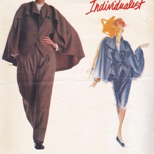 May include: A Vogue Patterns Individualist sewing pattern with an Issey Miyake design. The cover displays a woman in a brown cape and trousers suit, and a sketch of a woman in a blue cape and skirt suit. The pattern is rated Advanced Plus Difficile.