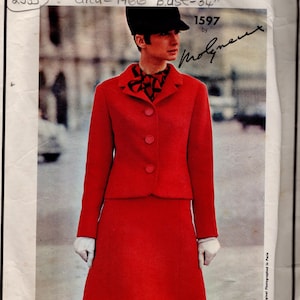 May include: A vintage Vogue Paris Original sewing pattern envelope featuring a red skirt suit with a three-button jacket and a patterned neck scarf. The text reads Vogue Paris Original, 2535, Circa 1966, Bust 34, 1597 by Molyneux.