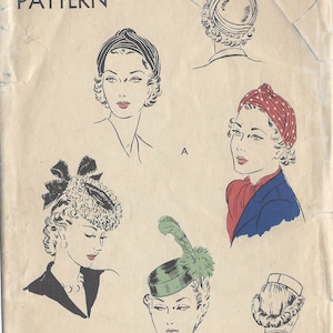 May include: A vintage Vogue sewing pattern for a hat, featuring five different hat styles. The pattern number is 8426 and the head size is 22. The pattern is dated 1940s.