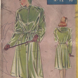 May include: A vintage sewing pattern for a green raincoat with a hood. The pattern is called "Fleetway" and is number 12. The pattern is for bust sizes 34, 36, and 38 inches.