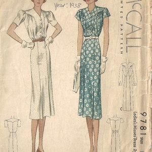 May include: Vintage McCall's sewing pattern for a dress, pattern number 9781, size 14, year 1938. The pattern shows two women wearing different styles of dresses, one with a white dress and the other with a blue and white polka dot dress.