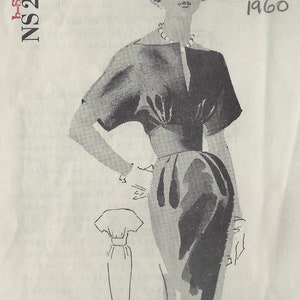 May include: A black and white illustration of a woman wearing a dress and a hat. The illustration is from a vintage sewing pattern for a dress, labeled "Spadea's International Designer Pattern" and "NS 229". The pattern is dated "June 1960" and designed by "Joset Walker".