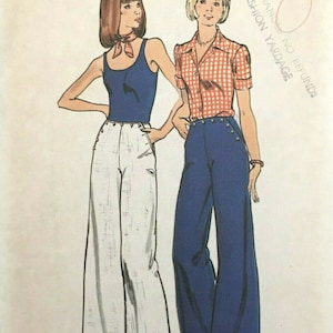 May include: A vintage sewing pattern for women's pants. The pattern shows two women wearing wide-legged pants, one in white and one in blue. The pattern is from Butterick, The Fashion One, and is number 3752.