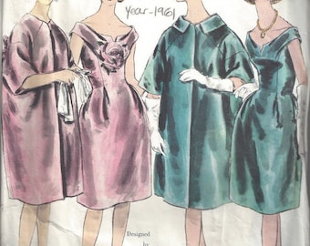 May include: Vintage Vogue Paris Original pattern 1082 designed by Lanvin Castillo, year 1961. The pattern features three women wearing different dresses. The first dress is a pink dress with a large flower on the bodice. The second dress is a teal green dress with a collar. The third dress is a dark green dress with a scoop neck.