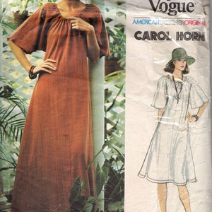 May include: A vintage sewing pattern for a dress with a gathered neckline and short sleeves. The pattern is by Carol Horn and is called "Very Easy Vogue." The pattern number is 1213.