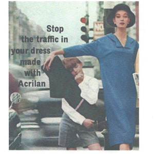 May include: A woman in a blue dress and a black hat stands on a city street. The text "Stop the traffic in your dress made with Acrilan" is visible in the image.