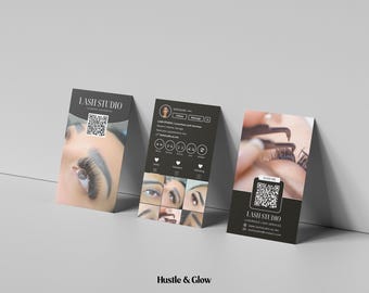 May include: Three black business cards for a lash studio. The cards feature close-up images of eyelashes, a QR code, and the studio's name. The cards are angled against a white wall.