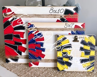 May include: Three rectangular wooden signs with natural wood grain, each featuring a painted pom-pom design. The largest sign is 8x10 inches, the medium is 5x7 inches, and the smallest is 4x4 inches, featuring a metal clip and twine accents.